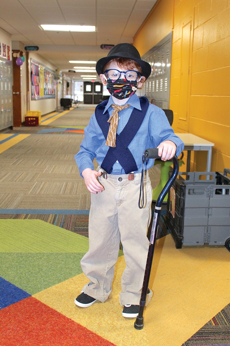 Bentley Turpin uses a cain to get around Monday at Hose Elementary as he and his fellow students celebrate the 100th day of the school year.